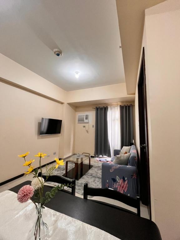 a living room with a couch and a table at Radiance Manila Bay Bayview Comfort with Pool & Pet-Friendly in Manila