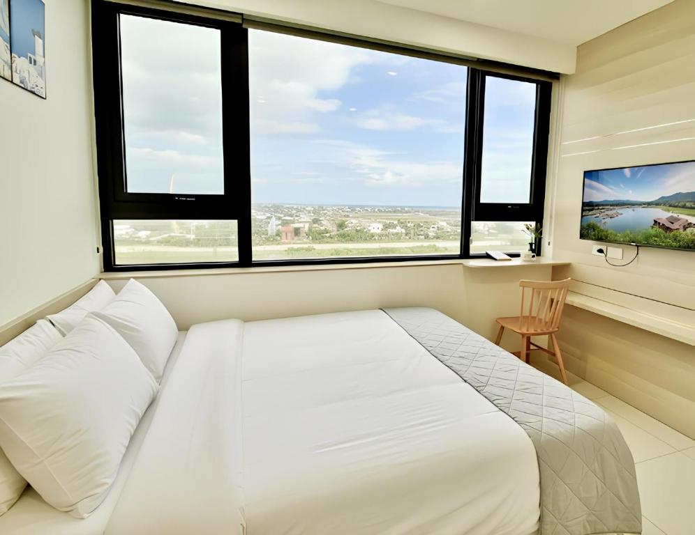 Giường trong phòng chung tại HAPPY HOUSE PREMIER - Căn Hộ 3PN Tiện Nghi , View Đẹp, Trung Tâm, Hồ Bơi&Gym Free