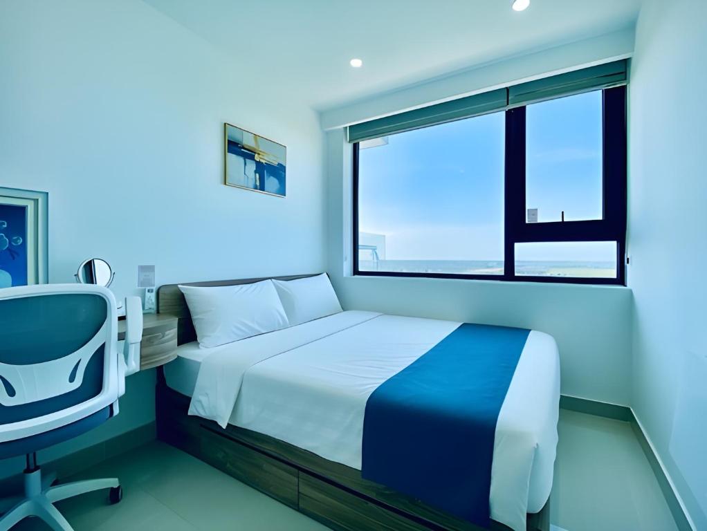 Giường trong phòng chung tại HAPPY HOUSE PREMIER - Căn Hộ 3PN Tiện Nghi , View Đẹp, Trung Tâm, Hồ Bơi&Gym Free