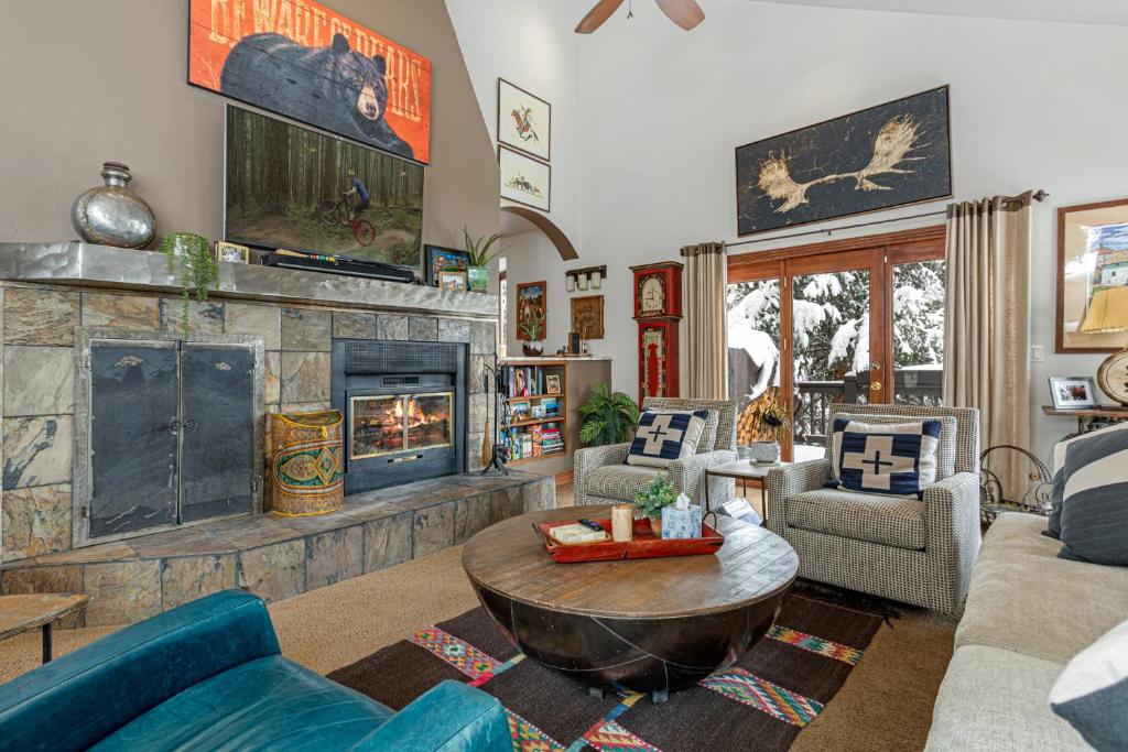 a living room with a couch and a fireplace at Luxury Home with Private Hot Tub, Woodburning Fireplace, Pet Friendly in Vail
