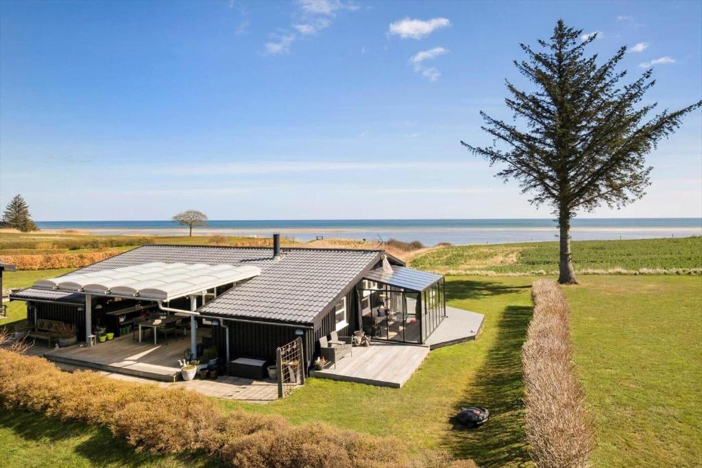 an aerial view of a house with the ocean in the background at OH451-Hadsund-Haslevgaarde-Bakker-72 in Hadsund