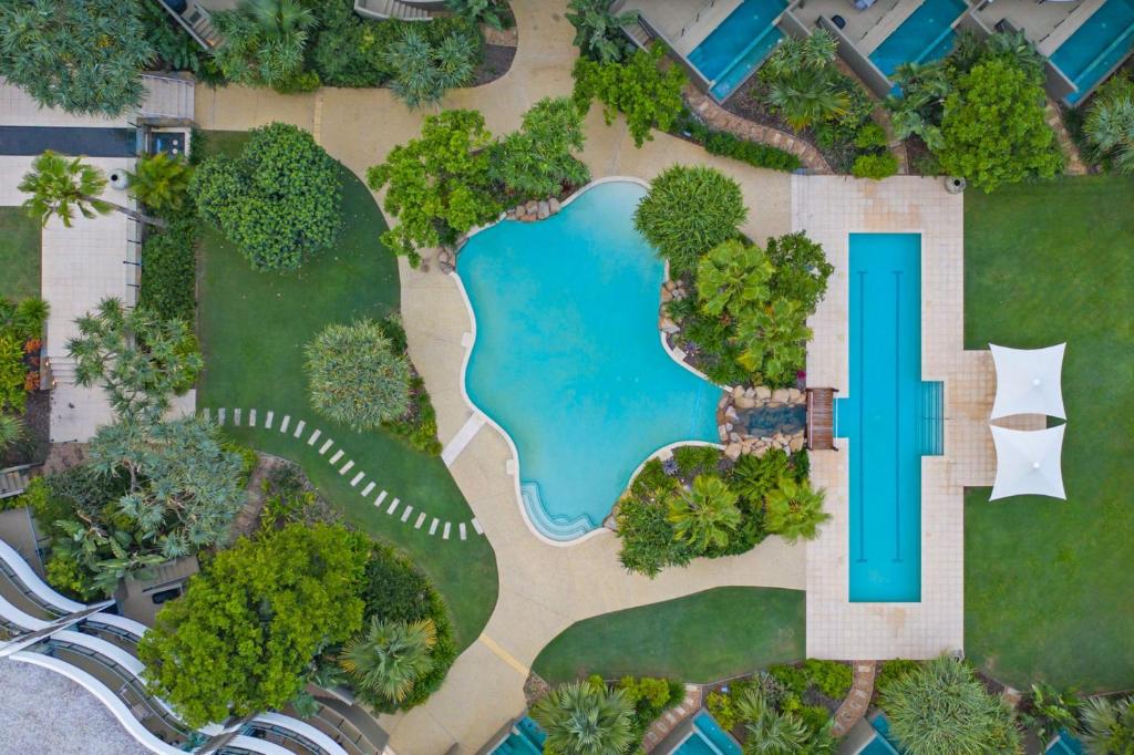 an aerial view of a park with a swimming pool at Cotton Beach 21 - Coastal Elegance with pool in Casuarina