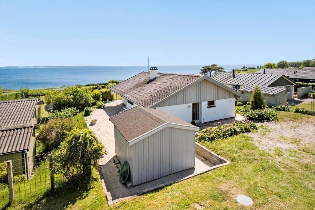 an aerial view of a house with the ocean in the background at FY290-Faaborg-Egholmvej-14 in Faaborg