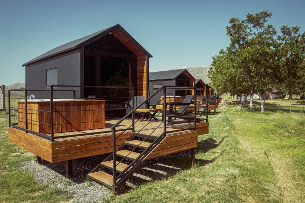 a house with stairs leading up to it at Amazing cabin in Samalayuca in Samalayuca