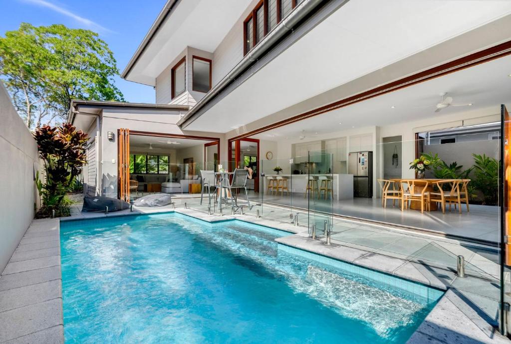 an image of a swimming pool in a house at Belle Escapes Sunset Boulevard in Palm Cove