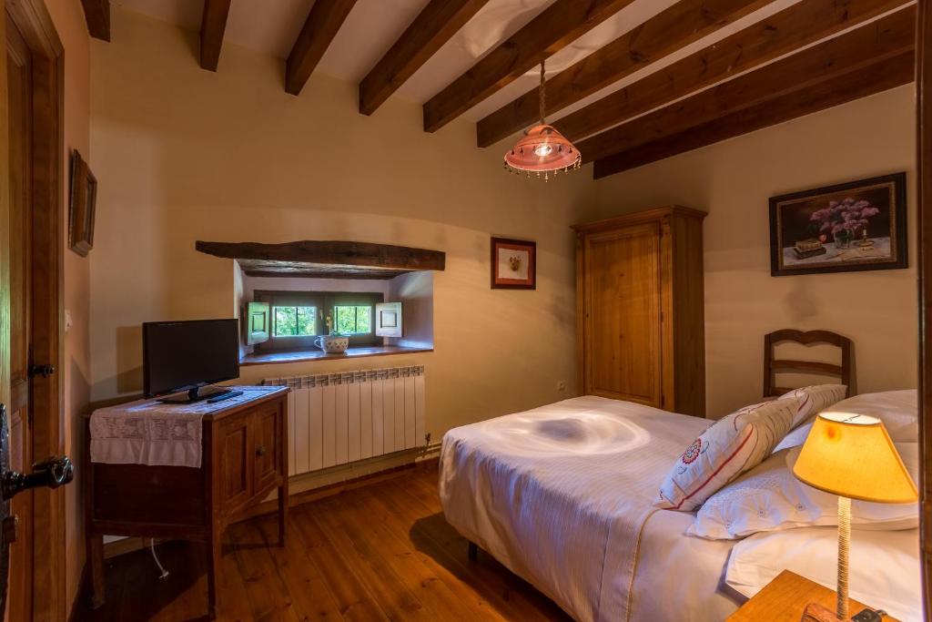 Postel nebo postele na pokoji v ubytování Casavieja Rural