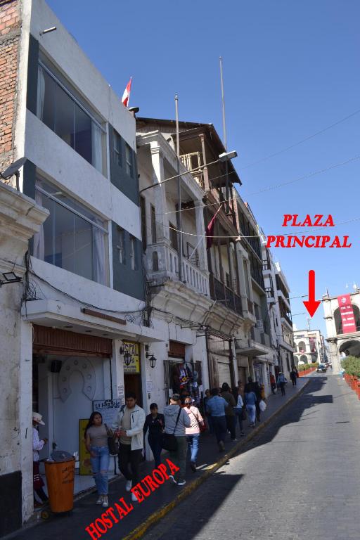a group of people standing outside of a building at Hostal Europa in Arequipa
