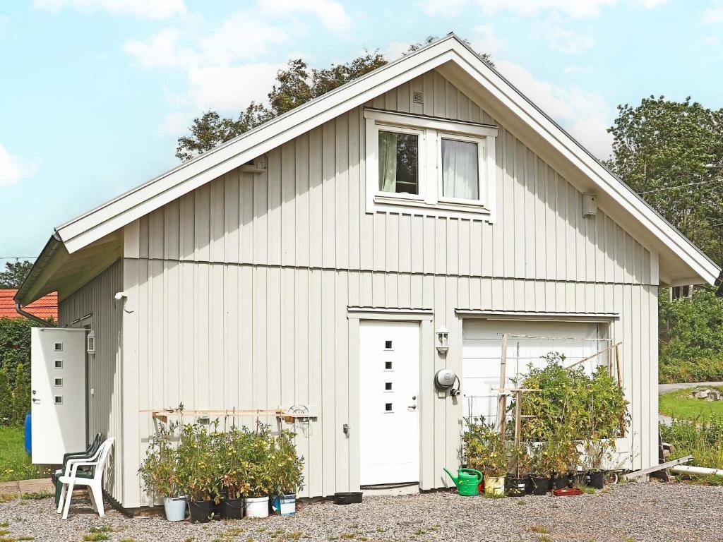 a white garage with a white door at 4 person holiday home in ONSALA-By Traum in Onsala