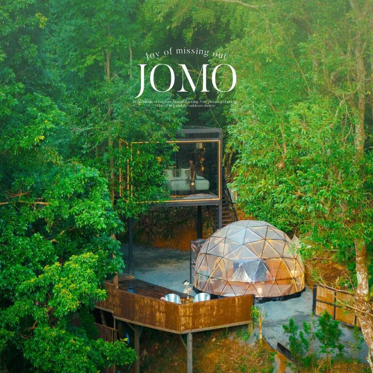 an aerial view of an iguana house in a forest at Morning Star Glamping in Ban Pok Nai