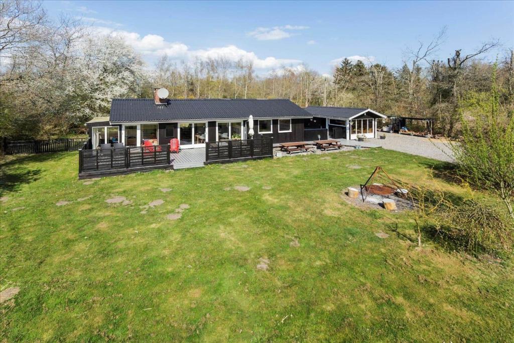 a house with a large yard in front of it at LF14223-Roslev-Livovej-9 in Roslev