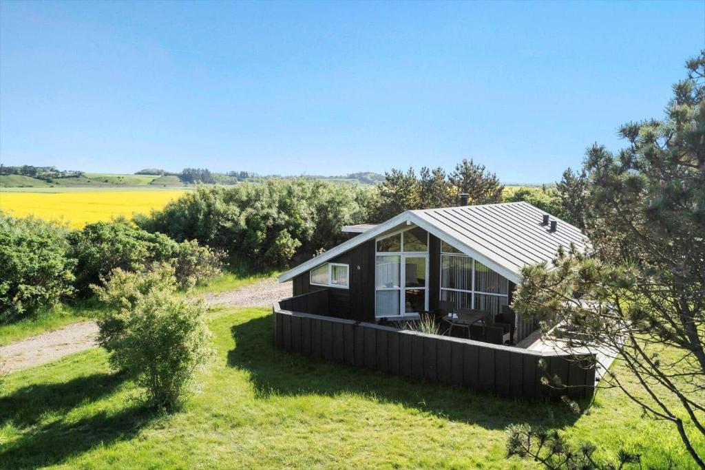 a small house in the middle of a field at LF403-Hurup-Thy-Klydevej-6 in Sindrup