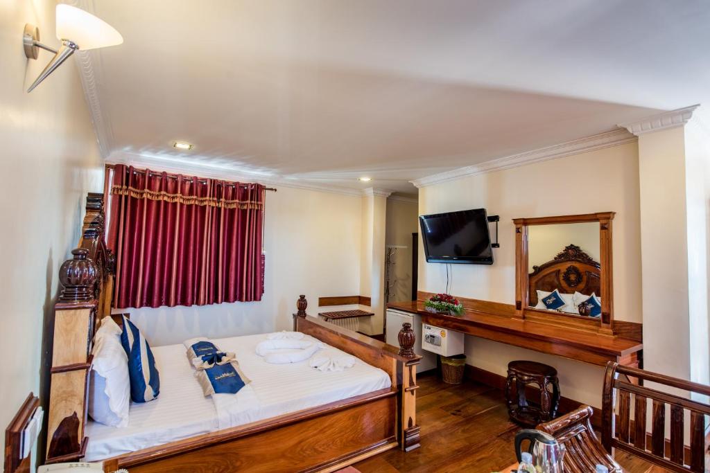 Postel nebo postele na pokoji v ubytování Seng Hout Hotel