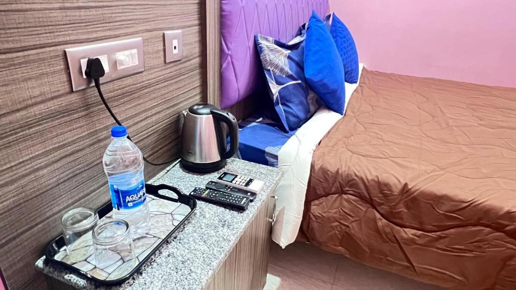 Ένα ή περισσότερα κρεβάτια σε δωμάτιο στο The Serenity Dream Residency