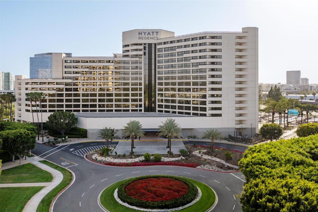 a large white building with a roundabout in front of it at Hyatt Regency Irvine in Irvine