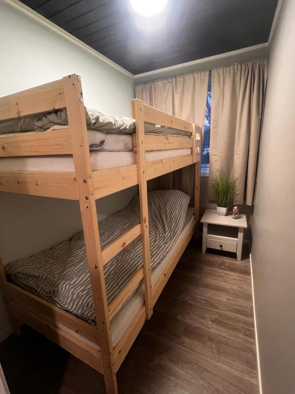a bunk bed with two bunk beds in a room at Trønderstua in Tromsø