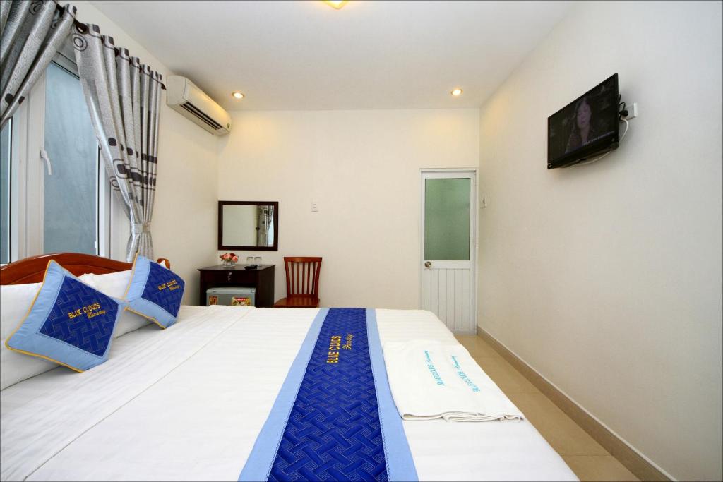 Postel nebo postele na pokoji v ubytování Blue Clouds Homestay
