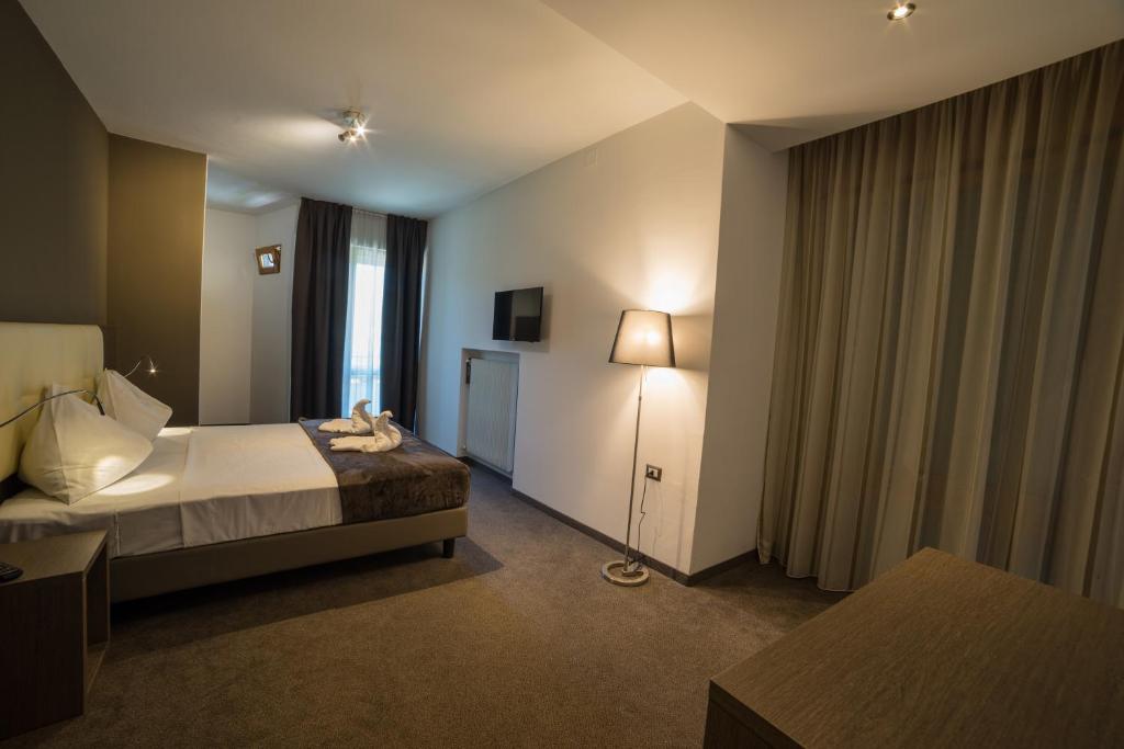 Postel nebo postele na pokoji v ubytování Hotel Raffl