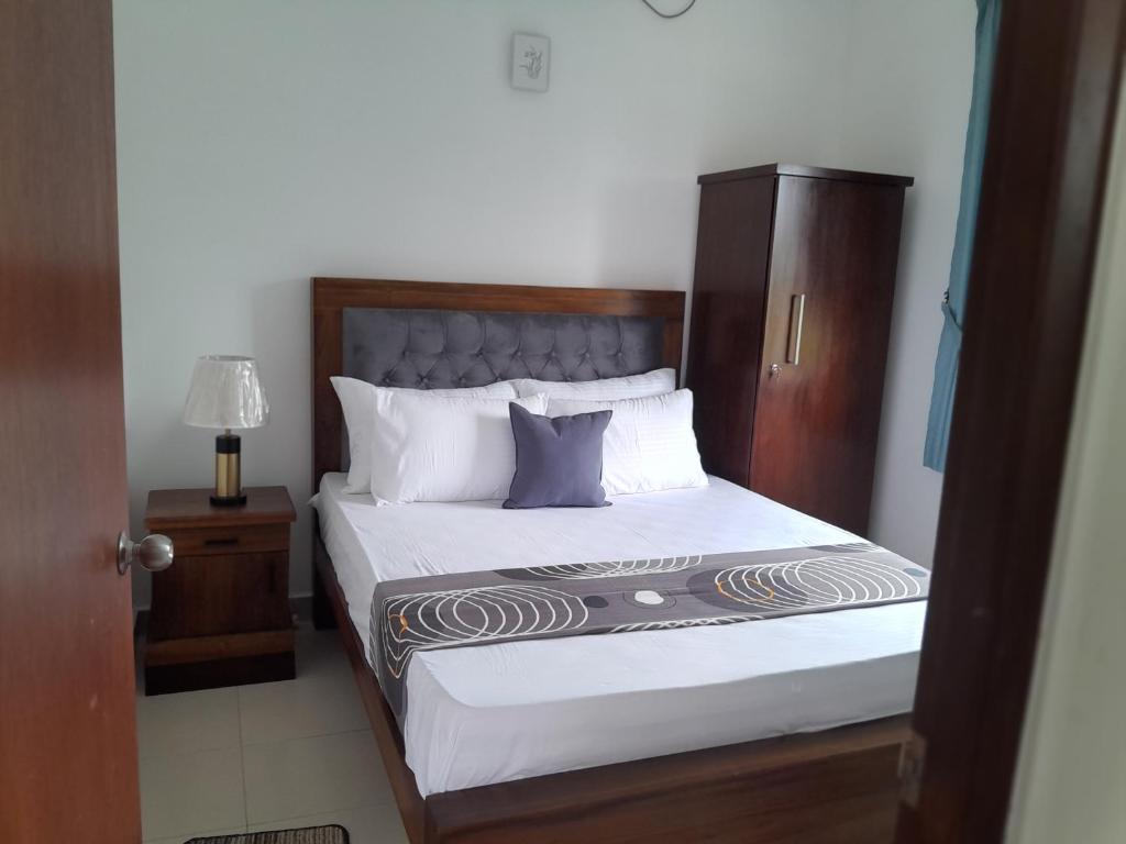 Postel nebo postele na pokoji v ubytování Du Apartment Colombo