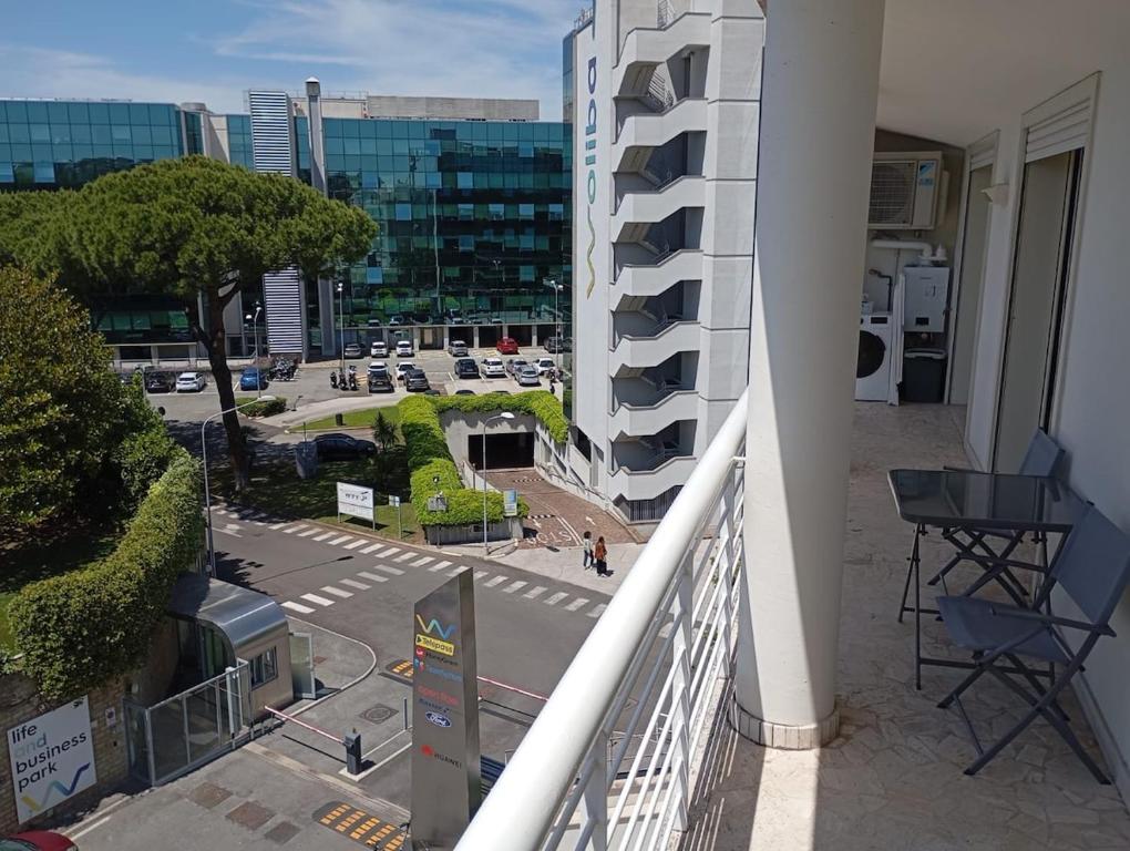 a balcony of a building with a view of a street at Modern and bright apartment in Rome