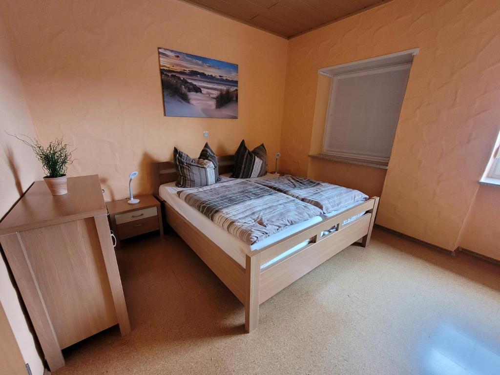 En eller flere senge i et værelse på Carpe Diem Wellness Ferienwohnung