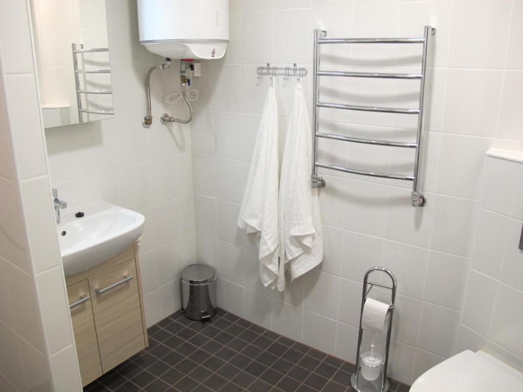 a bathroom with a toilet and a sink at Orissaare Apartment in Orissaare