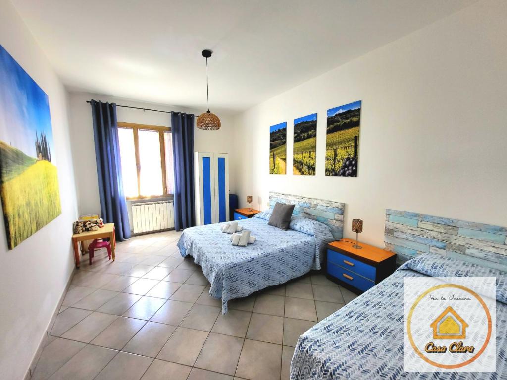 a bedroom with two beds in a room at Casa Clara in Cerreto Guidi