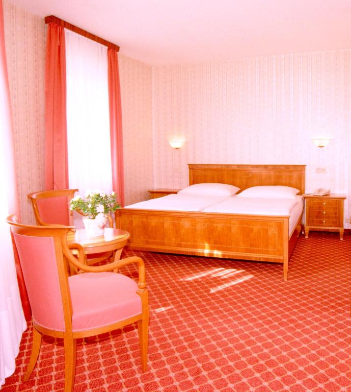 Postel nebo postele na pokoji v ubytování Hotel An Der Wien