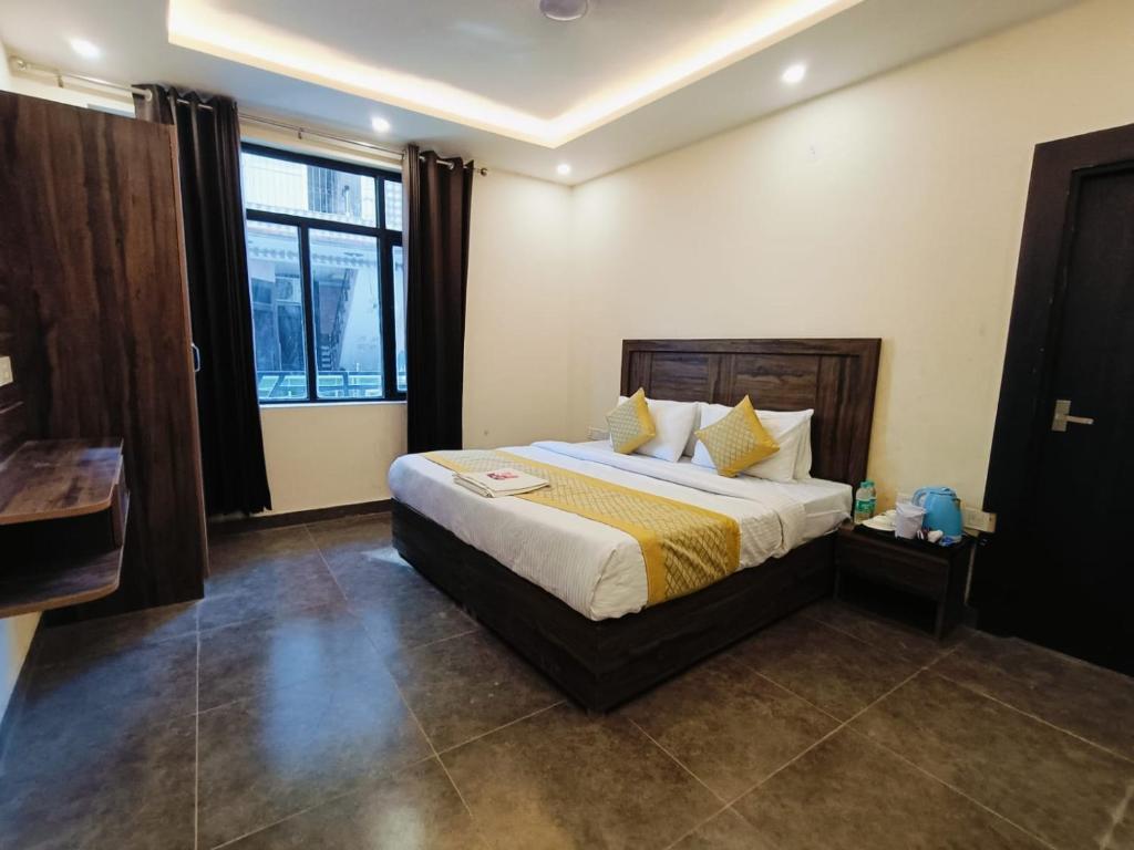 a bedroom with a large bed in a room at The Royal casa in Ghaziabad