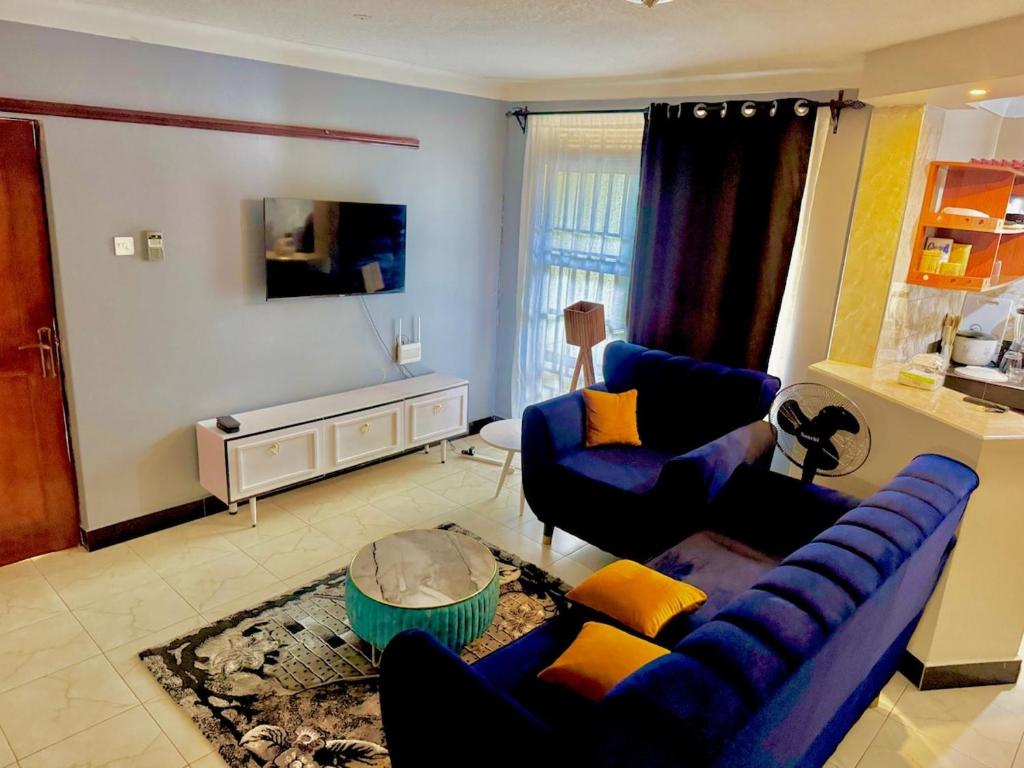 TV a/nebo společenská místnost v ubytování Sun city One bedroom Apt