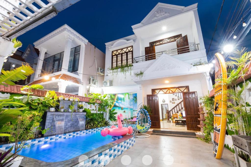 a house with a water park in front of it at Villages Sân BBQ Cạnh Hồ Bơi Đường Võ Thị Sáu in Vung Tau