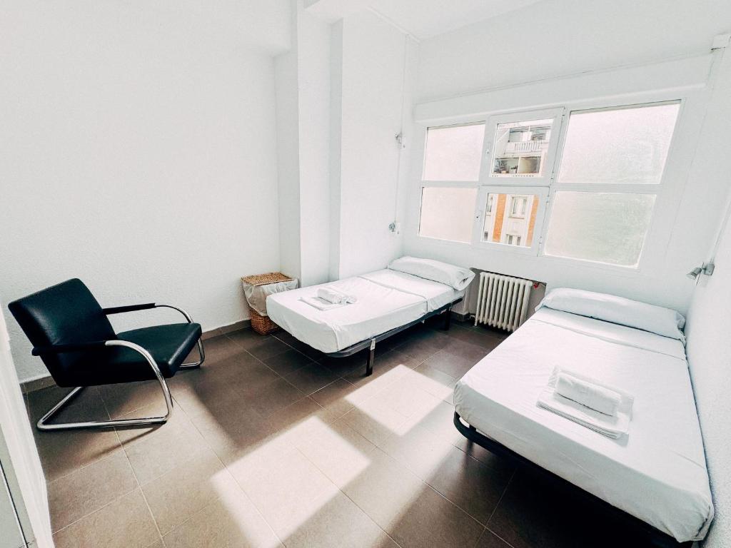 Cama o camas de una habitación en MadVibes Hostel Gran Vía