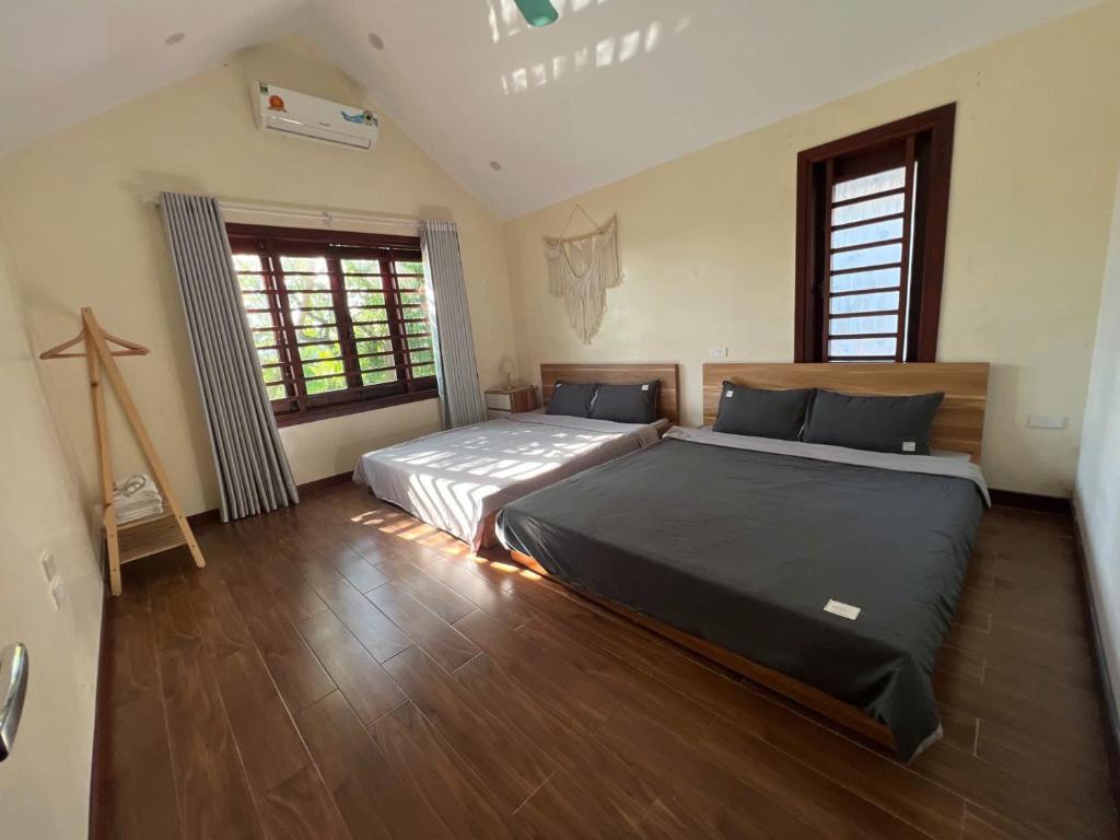 Ένα ή περισσότερα κρεβάτια σε δωμάτιο στο Villa Thu Trang