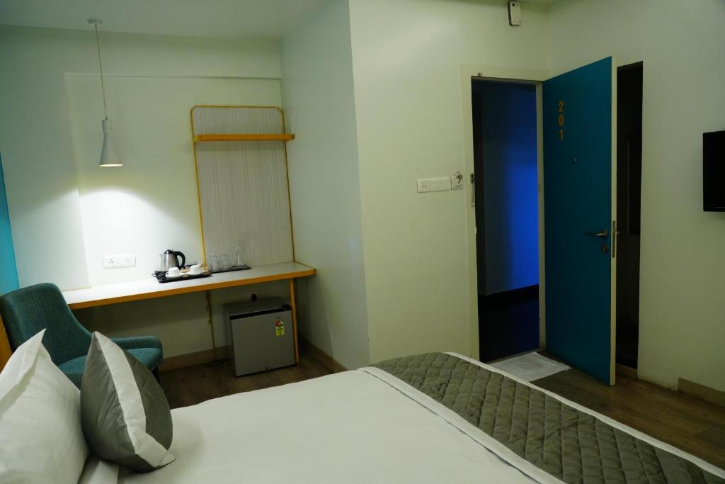 Imagine din galeria proprietății FabHotel SLR Residency în Bangalore