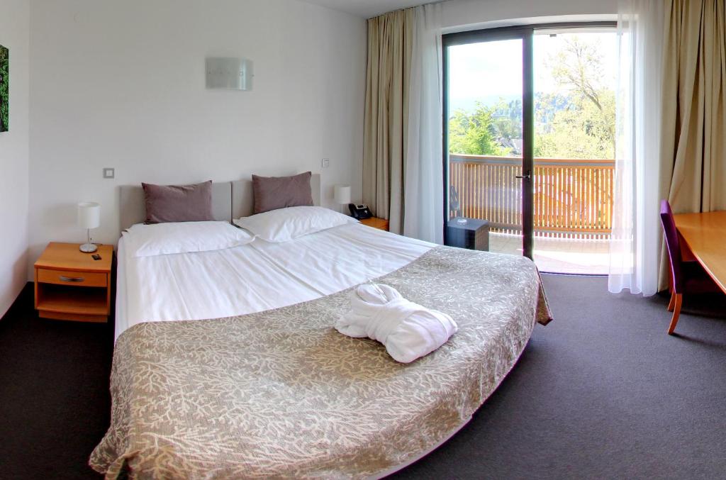 Postel nebo postele na pokoji v ubytování Hotel Astoria Superior