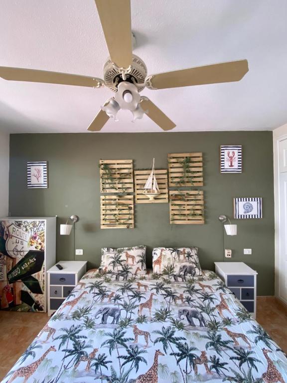 a bedroom with a bed with a ceiling fan at Costa Adeje Dream View - 2 Bedroom Apartment with Terrace in Adeje