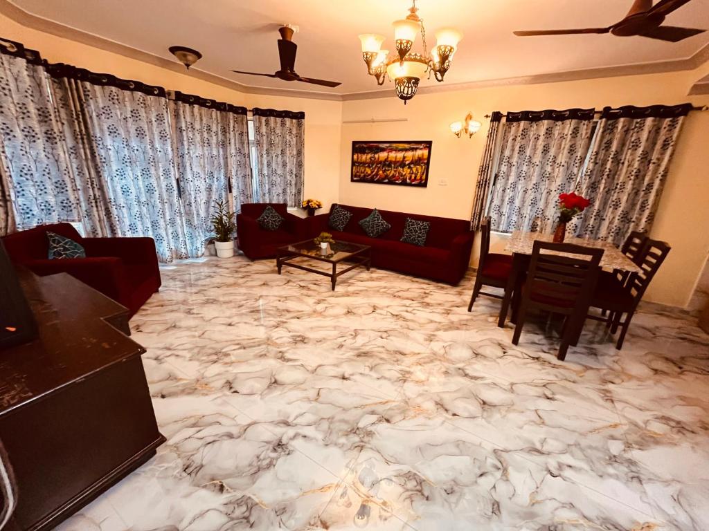 a living room with a large marble floor at Enclave Villa 4BHK in Lonavala