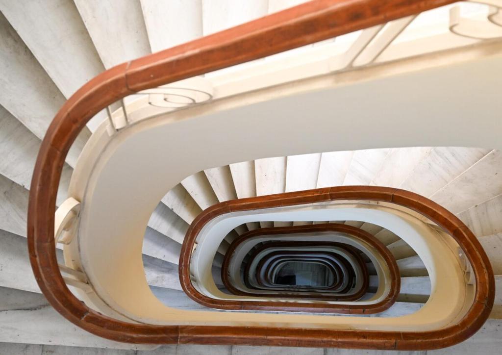 a spiral staircase in a building at Hera Luxury Suite by Zeus Suites in Athens