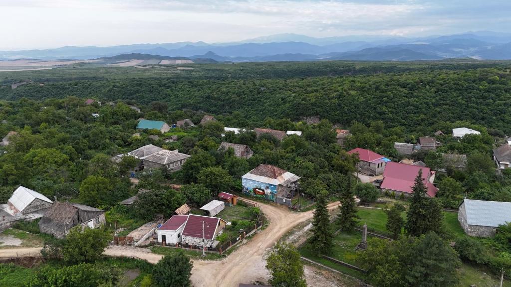an aerial view of a house in a village at Orbis Bude in Samshvilde