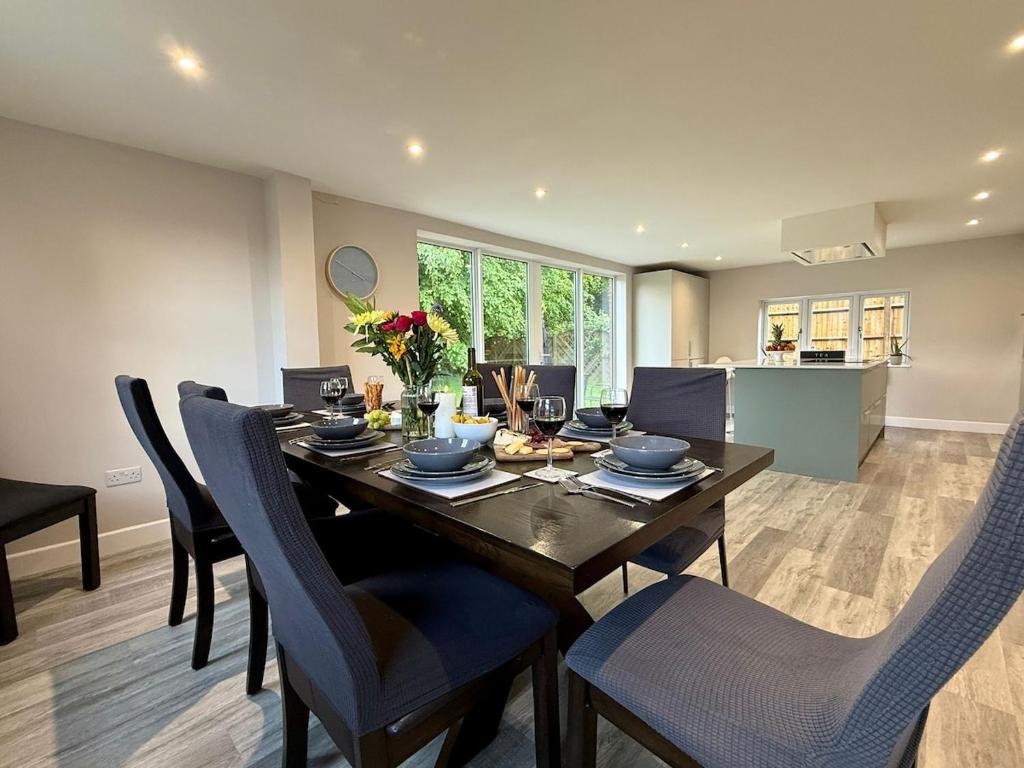 a dining room with a wooden table and chairs at The Refuge, Wendover in Wendover