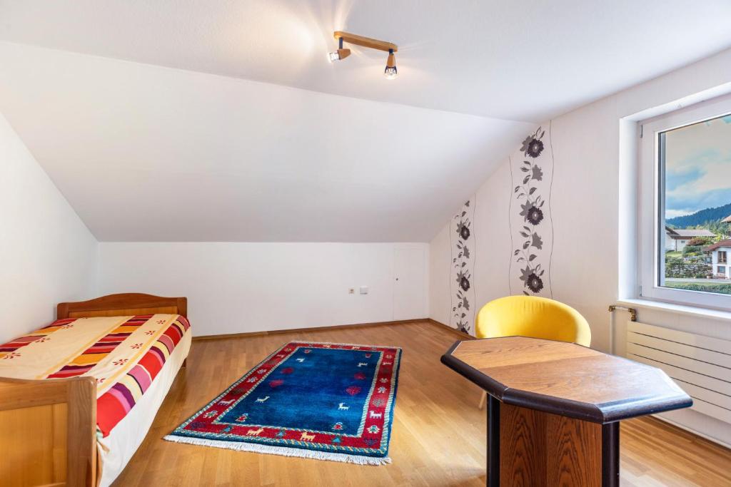 Postel nebo postele na pokoji v ubytování Ferienwohnung am Waldrand