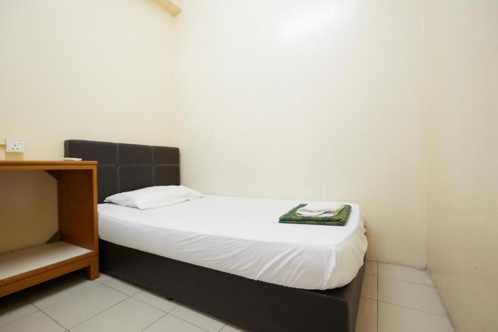 Postel nebo postele na pokoji v ubytování Rose Heritage Motel