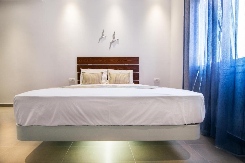 Postel nebo postele na pokoji v ubytování Petini's Place