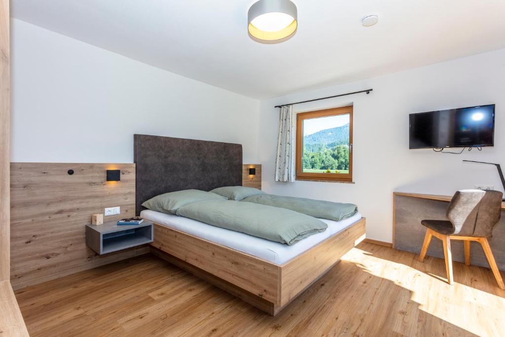 TV a/nebo společenská místnost v ubytování Obermühlhof Apartments