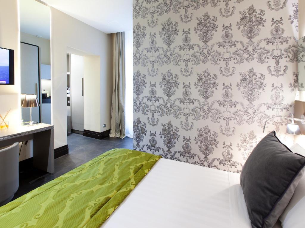 Posteľ alebo postele v izbe v ubytovaní Quirinale Luxury Rooms