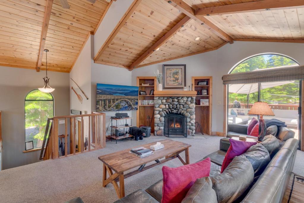 a living room with a couch and a fireplace at Modern 3BR Tahoe Cabin with Hot Tub in Tahoe City