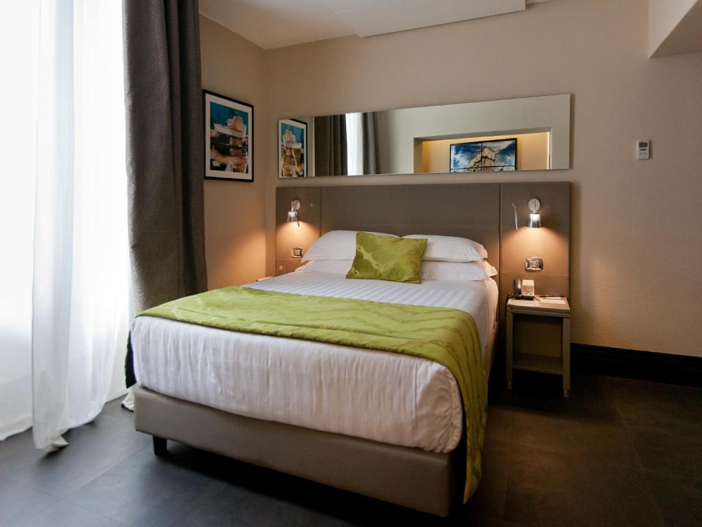 Posteľ alebo postele v izbe v ubytovaní Quirinale Luxury Rooms