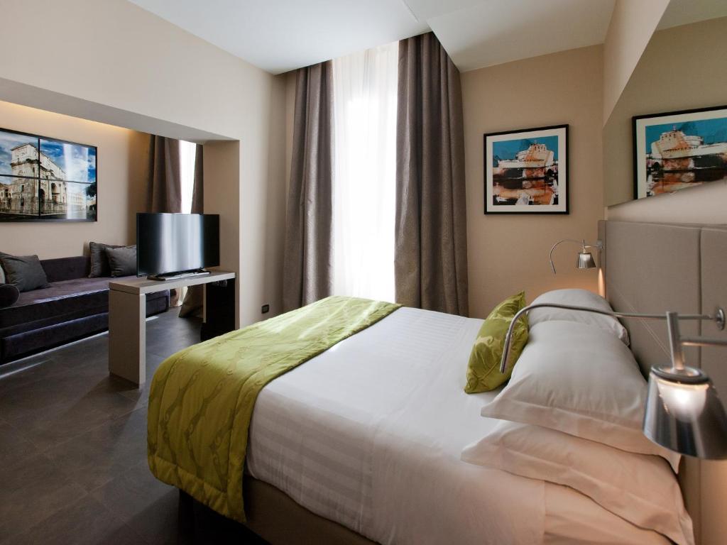Posteľ alebo postele v izbe v ubytovaní Quirinale Luxury Rooms
