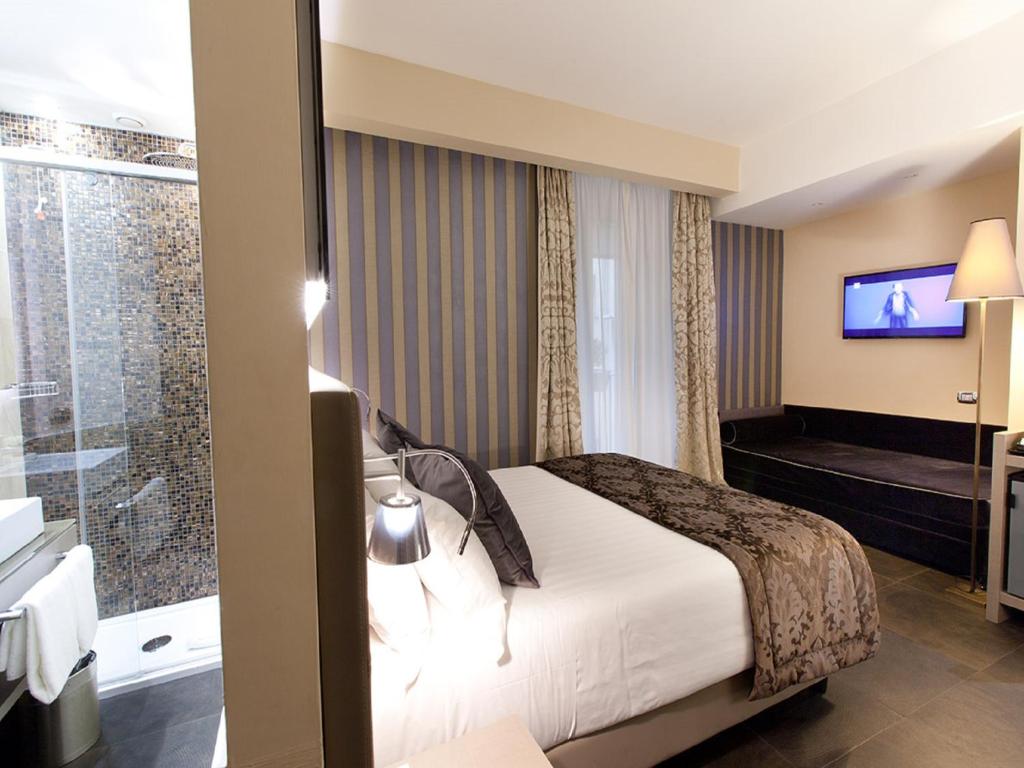 Posteľ alebo postele v izbe v ubytovaní Quirinale Luxury Rooms