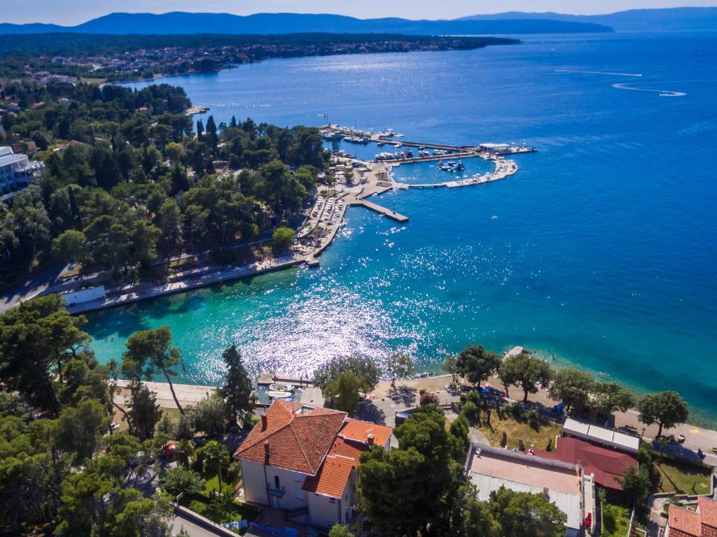 an aerial view of a resort on a lake at Apartments & Rooms Milcetic M in Malinska