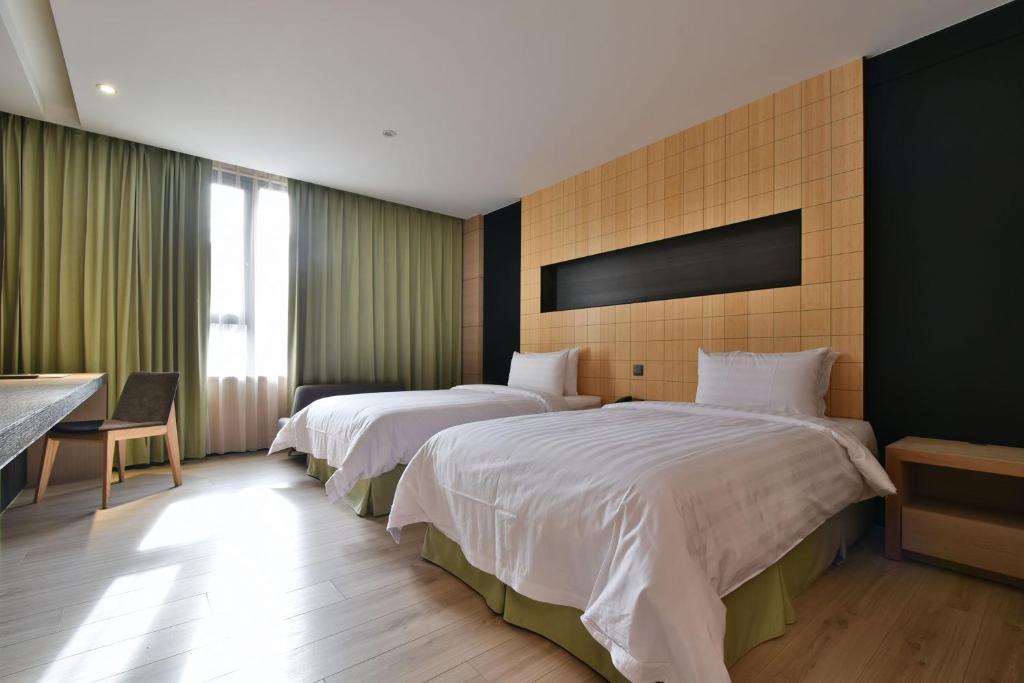Postel nebo postele na pokoji v ubytování Hotel R14